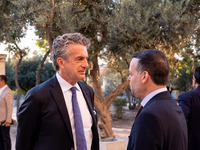 Stephen Dunbar-Johnson, the president of International of The New York Times Company, and Haris Doukas, the Mayor of Athens, participate in...