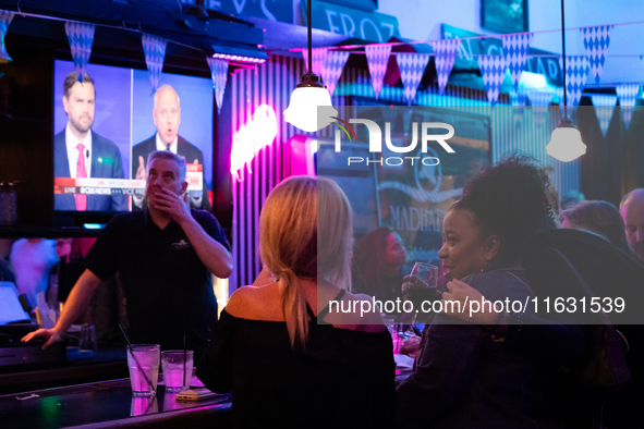 People attend a watch party at Madhatter for the vice presidential debate between Demcocrat Gov. Tim Walz (D-MN) and Republican Sen. J.D. Va...