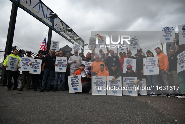 Longshoremen carry signs and demonstrate to make their voices heard outside Red Hook Terminal in Brooklyn, New York, United States, on Octob...