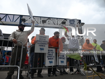 Longshoremen carry signs and demonstrate to make their voices heard outside Red Hook Terminal in Brooklyn, New York, United States, on Octob...