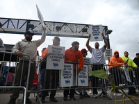 Longshoremen carry signs and demonstrate to make their voices heard outside Red Hook Terminal in Brooklyn, New York, United States, on Octob...