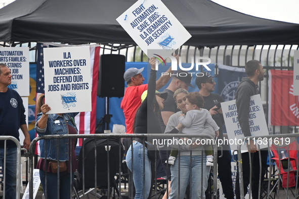 Longshoremen carry signs and demonstrate to make their voices heard outside Red Hook Terminal in Brooklyn, New York, United States, on Octob...