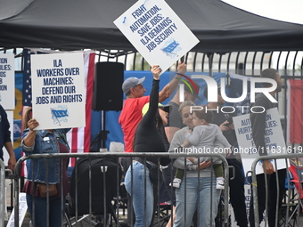 Longshoremen carry signs and demonstrate to make their voices heard outside Red Hook Terminal in Brooklyn, New York, United States, on Octob...