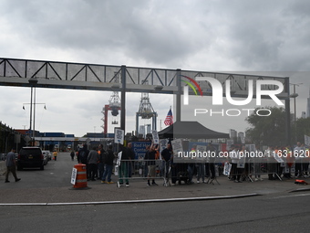 Longshoremen carry signs and demonstrate to make their voices heard outside Red Hook Terminal in Brooklyn, New York, United States, on Octob...