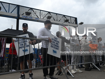 Longshoremen carry signs and demonstrate to make their voices heard outside Red Hook Terminal in Brooklyn, New York, United States, on Octob...