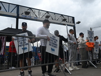 Longshoremen carry signs and demonstrate to make their voices heard outside Red Hook Terminal in Brooklyn, New York, United States, on Octob...