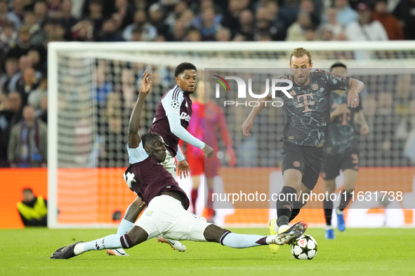 Harry Kane centre-forward of Bayern Munich and England and Amadou Onana defensive midfield of Aston Villa and Belgium compete for the ball d...