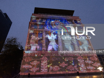 The creative production studio Kurbas Pro from Ukraine projects a video map during the opening of the Essen Light Festival 2024 in Essen, Ge...