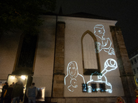 Denmark artists Jakob Falling and Ole Samsoe's artwork is projected during the opening of the Essen Light Festival 2024 in Essen, Germany, o...