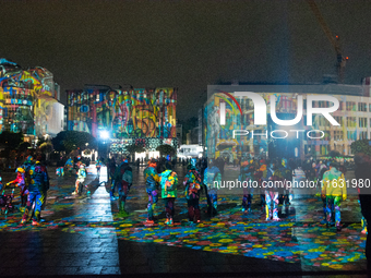 German artist DANIEL MARGRAF's projection is seen at Kennedy Square during the opening of the Essen Light Festival 2024 in Essen, Germany, o...