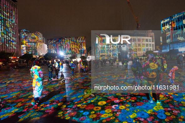 German artist DANIEL MARGRAF's projection is seen at Kennedy Square during the opening of the Essen Light Festival 2024 in Essen, Germany, o...