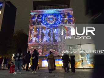 The creative production studio Kurbas Pro from Ukraine projects a video map during the opening of the Essen Light Festival 2024 in Essen, Ge...