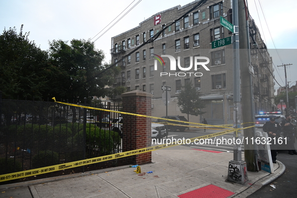 The NYPD Crime Scene Unit canvasses the area outside a senior center where 40-year-old Kavon Reid collapses after he is shot in Bronx, New Y...