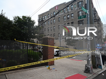 The NYPD Crime Scene Unit canvasses the area outside a senior center where 40-year-old Kavon Reid collapses after he is shot in Bronx, New Y...