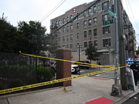 The NYPD Crime Scene Unit canvasses the area outside a senior center where 40-year-old Kavon Reid collapses after he is shot in Bronx, New Y...