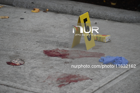 The NYPD Crime Scene Unit canvasses the area outside a senior center where 40-year-old Kavon Reid collapses after he is shot in Bronx, New Y...