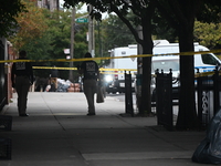 The NYPD Crime Scene Unit canvasses the area outside a senior center where 40-year-old Kavon Reid collapses after he is shot in Bronx, New Y...