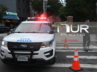 The NYPD Crime Scene Unit canvasses the area outside a senior center where 40-year-old Kavon Reid collapses after he is shot in Bronx, New Y...