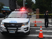 The NYPD Crime Scene Unit canvasses the area outside a senior center where 40-year-old Kavon Reid collapses after he is shot in Bronx, New Y...