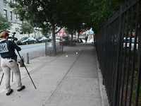 The NYPD Crime Scene Unit canvasses the area outside a senior center where 40-year-old Kavon Reid collapses after he is shot in Bronx, New Y...