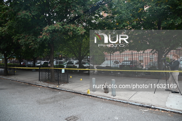 The NYPD Crime Scene Unit canvasses the area outside a senior center where 40-year-old Kavon Reid collapses after he is shot in Bronx, New Y...