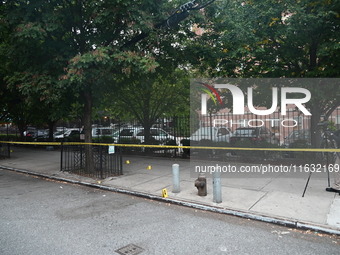 The NYPD Crime Scene Unit canvasses the area outside a senior center where 40-year-old Kavon Reid collapses after he is shot in Bronx, New Y...