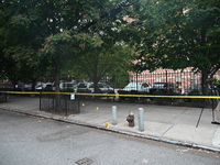 The NYPD Crime Scene Unit canvasses the area outside a senior center where 40-year-old Kavon Reid collapses after he is shot in Bronx, New Y...