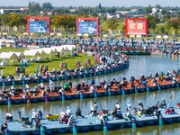 Participants take part in a fishing contest at Sihong International Round Pond in Suqian, China, on October 2, 2024. (