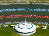 Participants take part in a fishing contest at Sihong International Round Pond in Suqian, China, on October 2, 2024. (