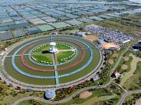 Participants take part in a fishing contest at Sihong International Round Pond in Suqian, China, on October 2, 2024. (