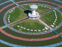 Participants take part in a fishing contest at Sihong International Round Pond in Suqian, China, on October 2, 2024. (