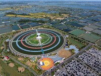 Participants take part in a fishing contest at Sihong International Round Pond in Suqian, China, on October 2, 2024. (