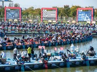 Participants take part in a fishing contest at Sihong International Round Pond in Suqian, China, on October 2, 2024. (