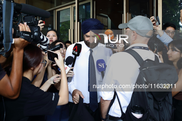 Davinder Singh, the defense counsel of Singapore's former Transport Minister S. Iswaran, leaves the Supreme Court in Singapore, on October 3...