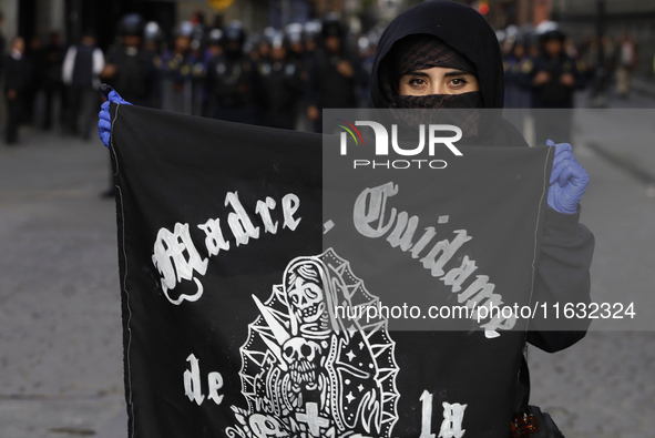 Members of the Anarchist Black Bloc march in Mexico City, Mexico, on October 2, 2024, on the 56th anniversary of the Tlatelolco Massacre tha...