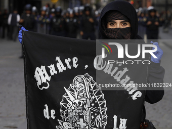 Members of the Anarchist Black Bloc march in Mexico City, Mexico, on October 2, 2024, on the 56th anniversary of the Tlatelolco Massacre tha...