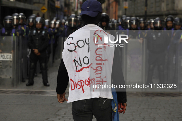 Members of the Anarchist Black Bloc march in Mexico City, Mexico, on October 2, 2024, on the 56th anniversary of the Tlatelolco Massacre tha...