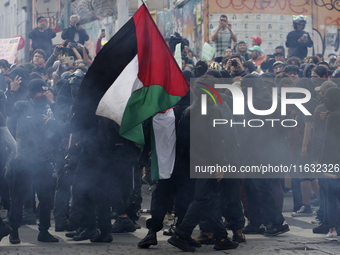 Members of the Anarchist Black Bloc march in Mexico City, Mexico, on October 2, 2024, on the 56th anniversary of the Tlatelolco Massacre tha...