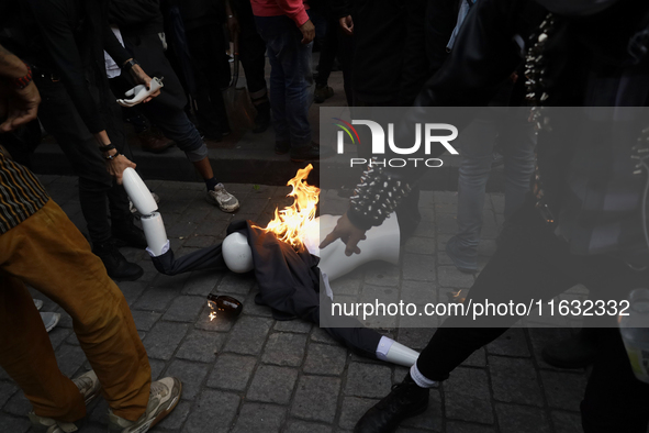 Members of the Bloque Negro Anarquista (Anarchist Black Bloc) take action on establishments in Mexico City, Mexico, on October 2, 2024, duri...