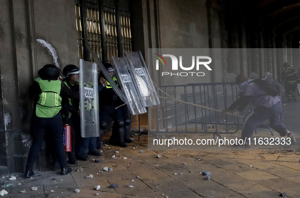 Members of the Anarchist Black Bloc clash with police during the march to mark the 56th anniversary of the Tlatelolco Massacre, which starts...