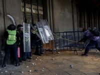 Members of the Anarchist Black Bloc clash with police during the march to mark the 56th anniversary of the Tlatelolco Massacre, which starts...