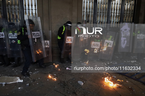 Members of the Anarchist Black Bloc clash with police during the march to mark the 56th anniversary of the Tlatelolco Massacre, which starts...