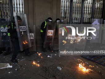 Members of the Anarchist Black Bloc clash with police during the march to mark the 56th anniversary of the Tlatelolco Massacre, which starts...