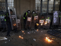 Members of the Anarchist Black Bloc clash with police during the march to mark the 56th anniversary of the Tlatelolco Massacre, which starts...