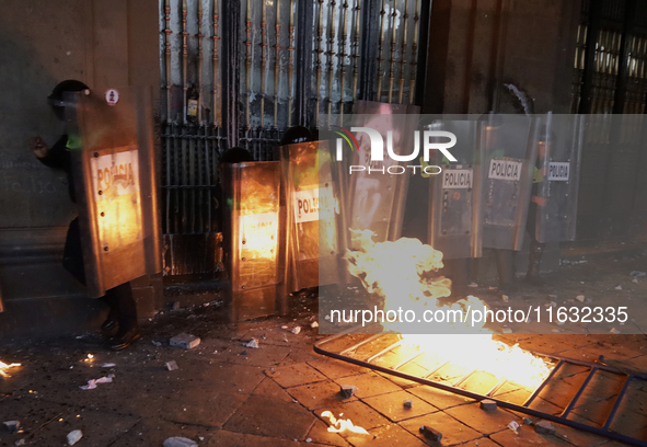 Members of the Anarchist Black Bloc clash with police during the march to mark the 56th anniversary of the Tlatelolco Massacre, which starts...