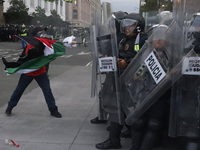 Members of the Anarchist Black Bloc clash with police during the march to mark the 56th anniversary of the Tlatelolco Massacre, which starts...