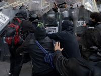 Members of the Anarchist Black Bloc clash with police during the march to mark the 56th anniversary of the Tlatelolco Massacre, which starts...