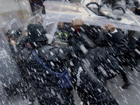 Members of the Anarchist Black Bloc clash with police during the march to mark the 56th anniversary of the Tlatelolco Massacre, which starts...