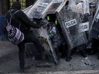 Members of the Anarchist Black Bloc clash with police during the march to mark the 56th anniversary of the Tlatelolco Massacre, which starts...