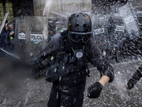 Members of the Anarchist Black Bloc clash with police during the march to mark the 56th anniversary of the Tlatelolco Massacre, which starts...